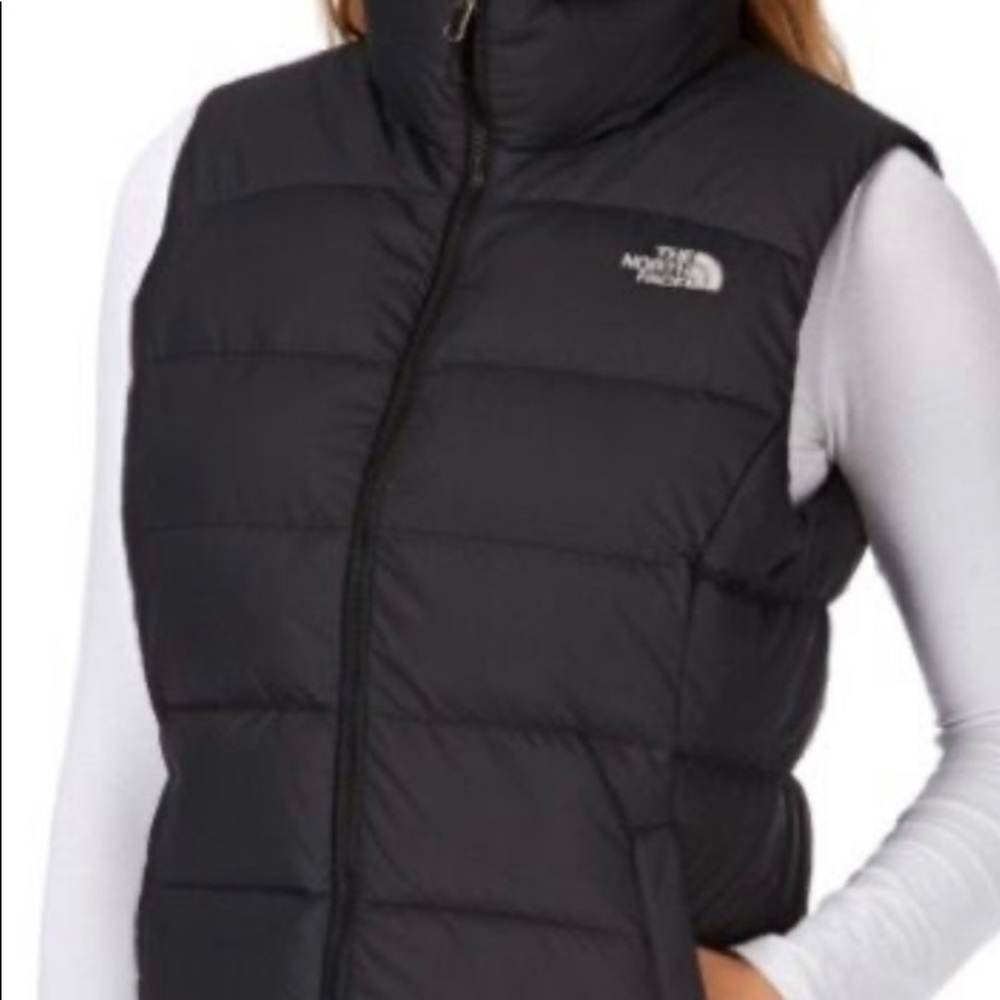 Small, North Face women’s puffy black vest. Lightly worn.